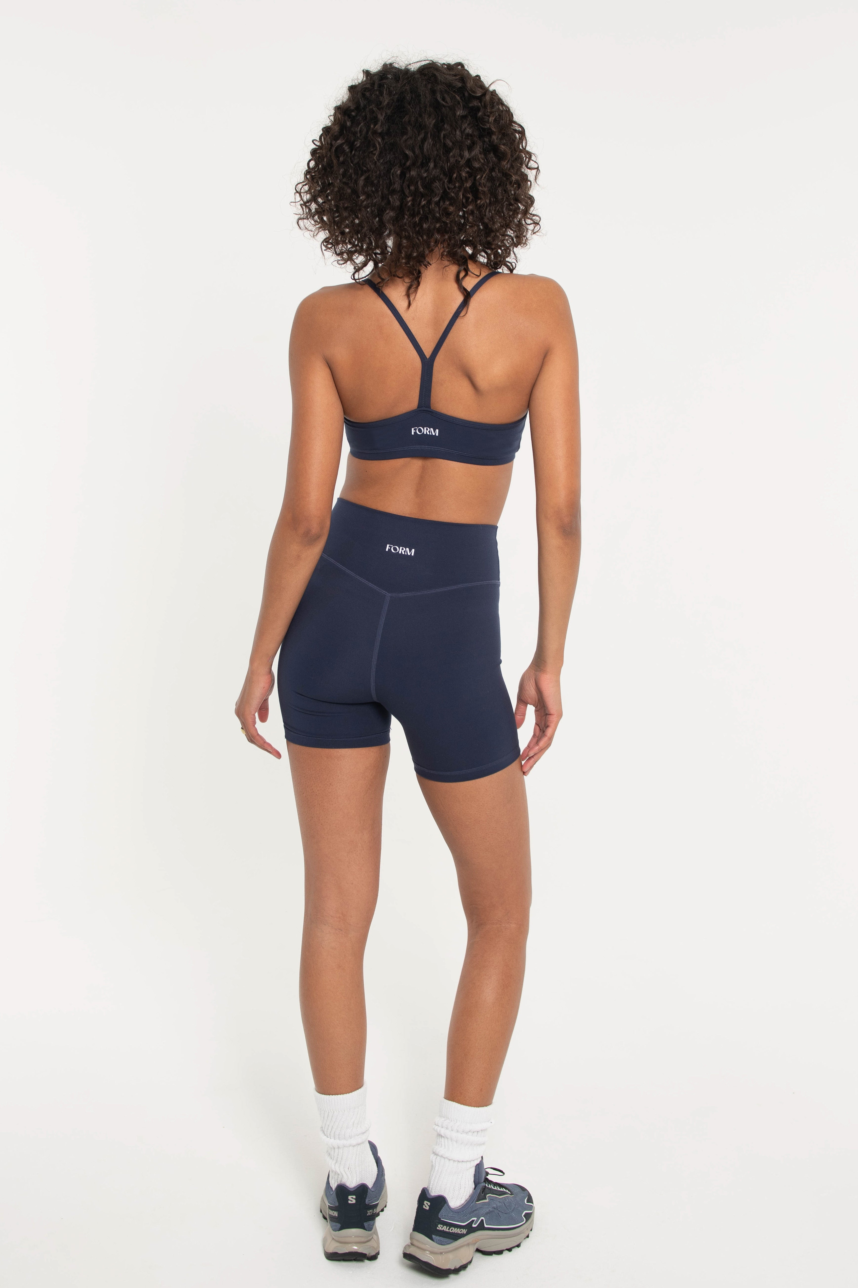 navy slim sports bra with Y back and matching biker shorts
